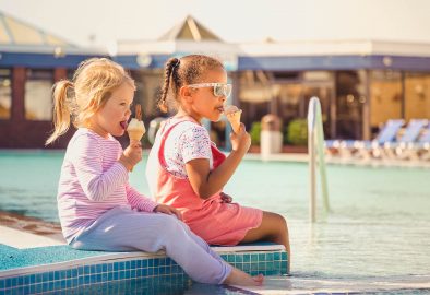 Kids By Pool Eating Ice Cream
