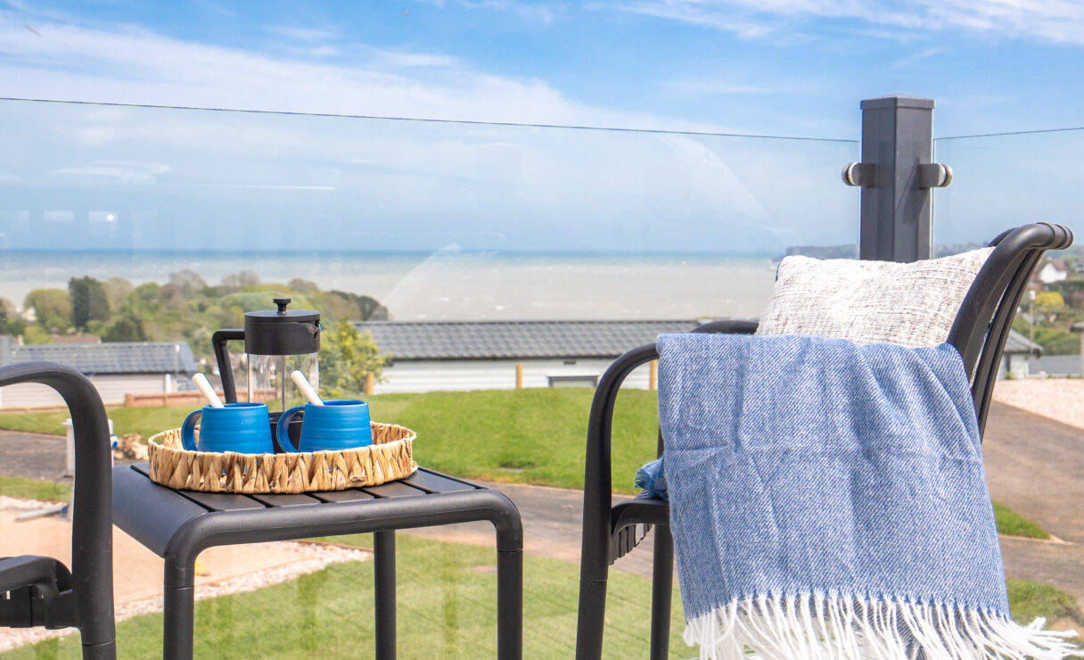 ABI Balmoral Lodge Deck on Harbour Heights with coffee