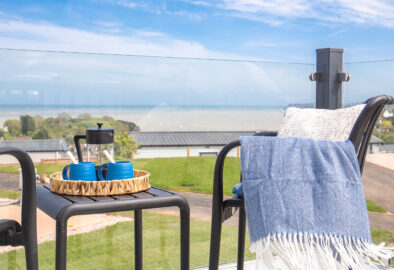 ABI Balmoral Lodge Deck on Harbour Heights with coffee