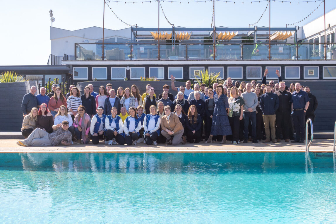 Beverley Holidays Team posing by outdoor pool