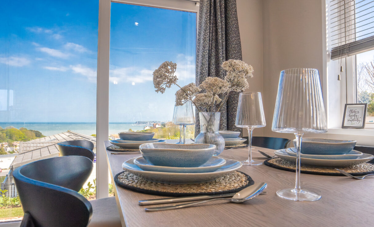 Victory View Lodge dressed dining table with sea view