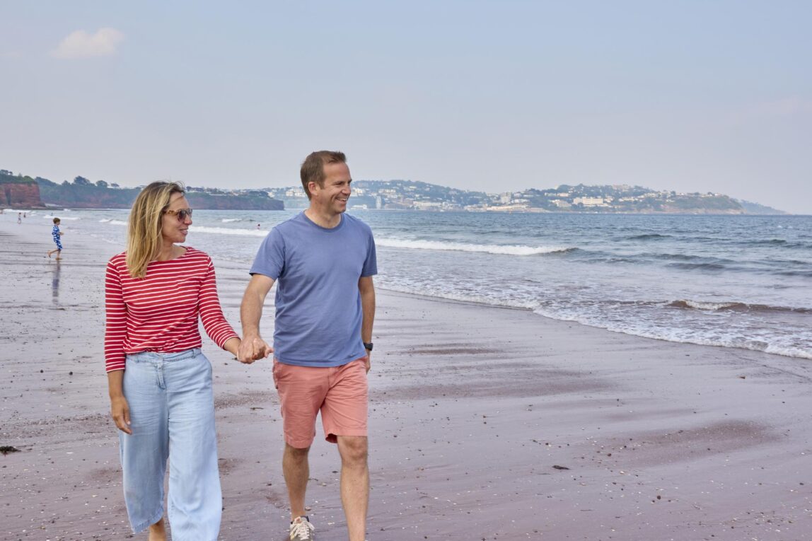 Try Before You Buy - Couple walking on Paignton Seafront Beach