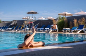 Couple in outdoor swimming pool